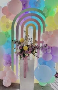 Rainbow arch backdrop and balloon garland